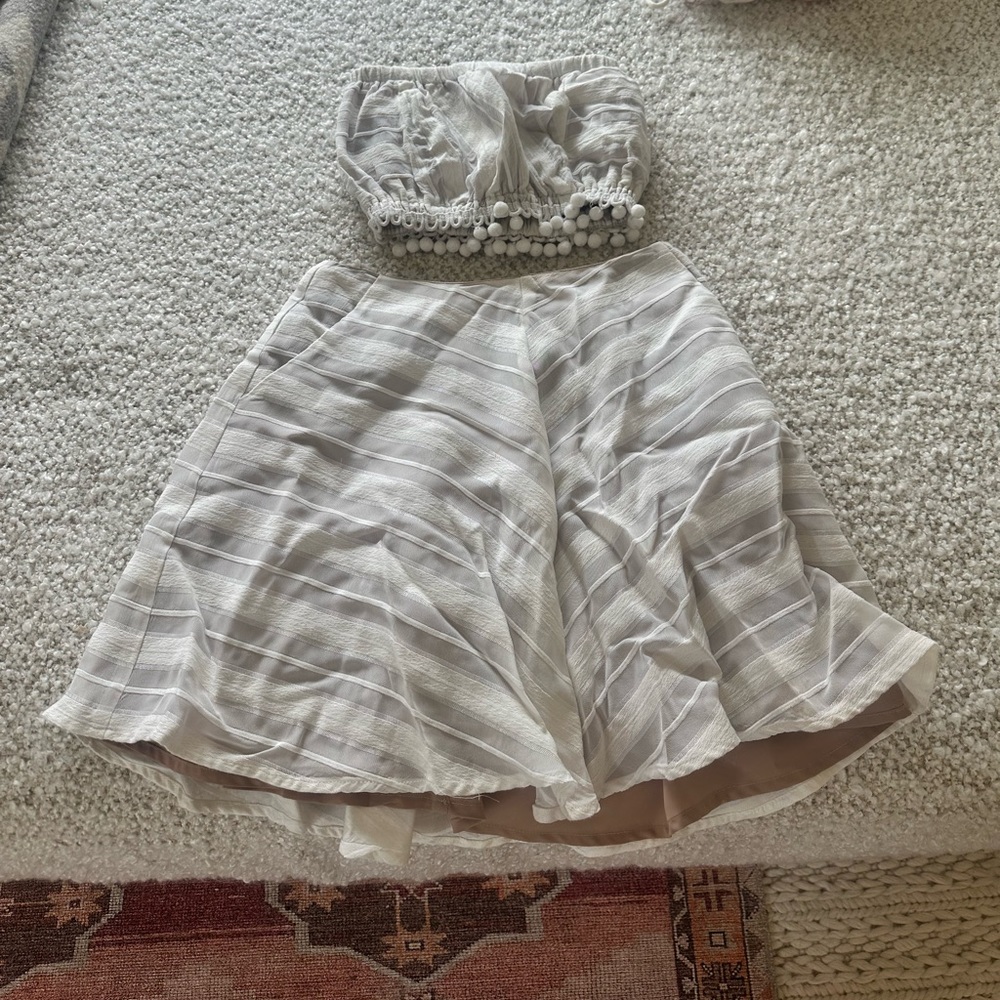 For Love and Lemons off-white mini skirt and strapless top set.